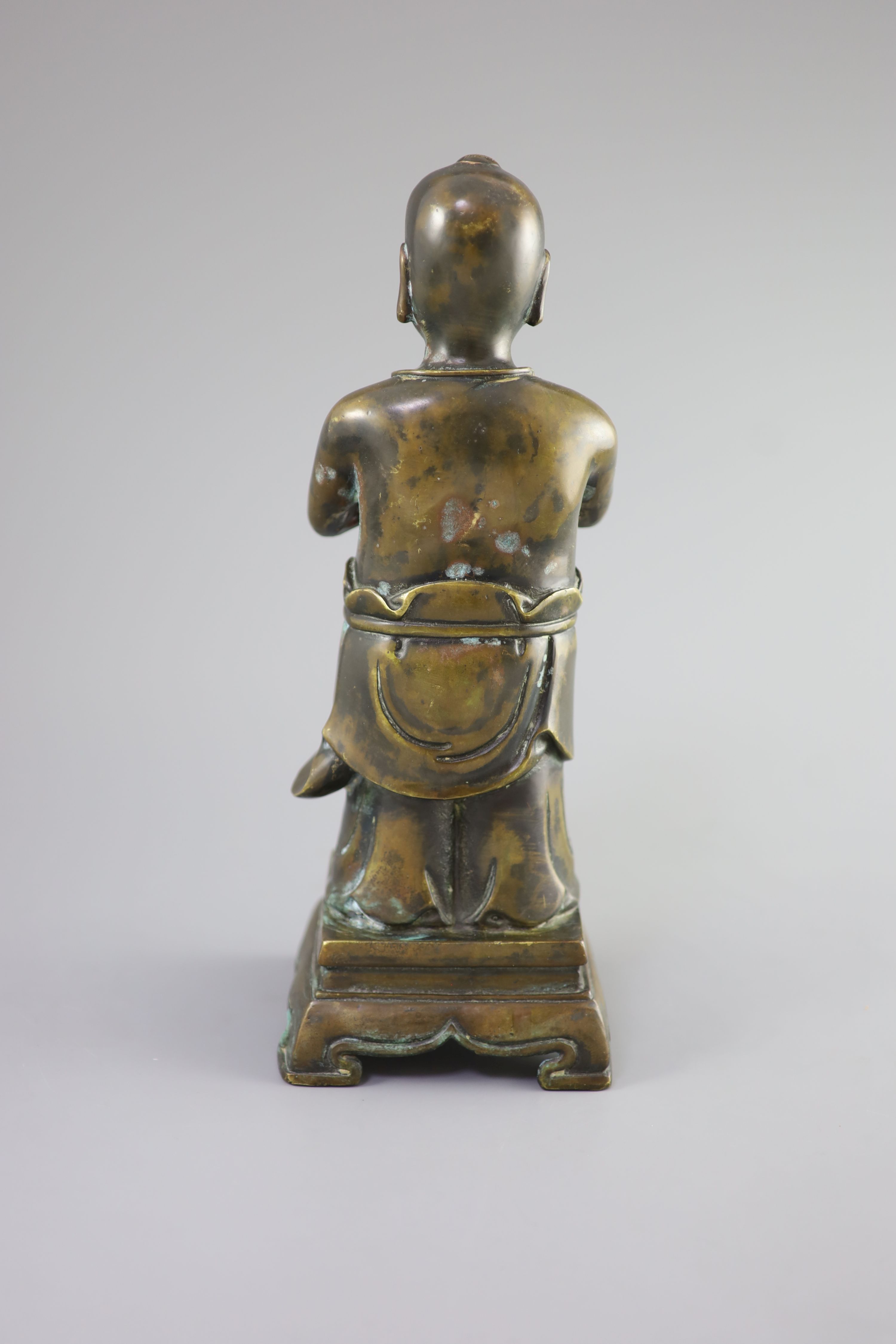 A Chinese bronze standing figure of Shancai Tongzi, 34cm high